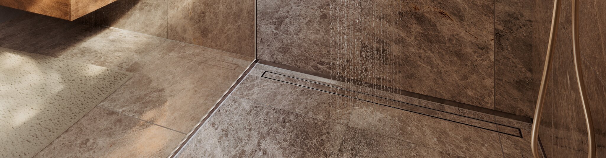Modern floor-level shower enclosure with a glass partition, brown marbled tiles and a KERDI-LINE-TF tilable shower drainage channel