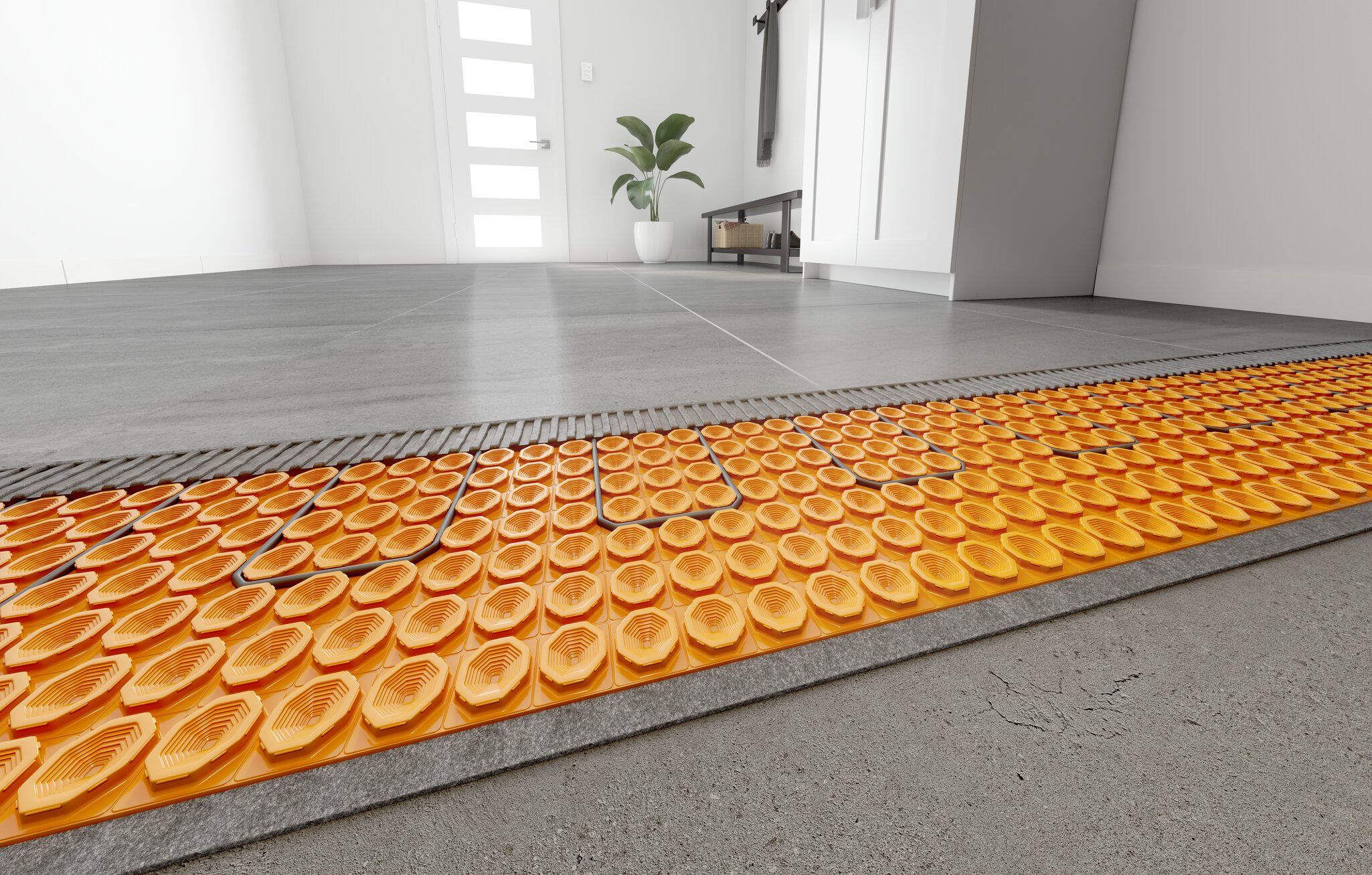 Plancher de céramique avec une membrane de désolidarisation orange pour plancher chauffant électrique DITRA-HEAT