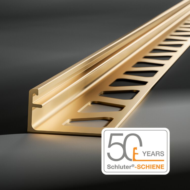 Bordure de carrelage Gold Schiene avec fond gris et logo du 50e anniversaire.