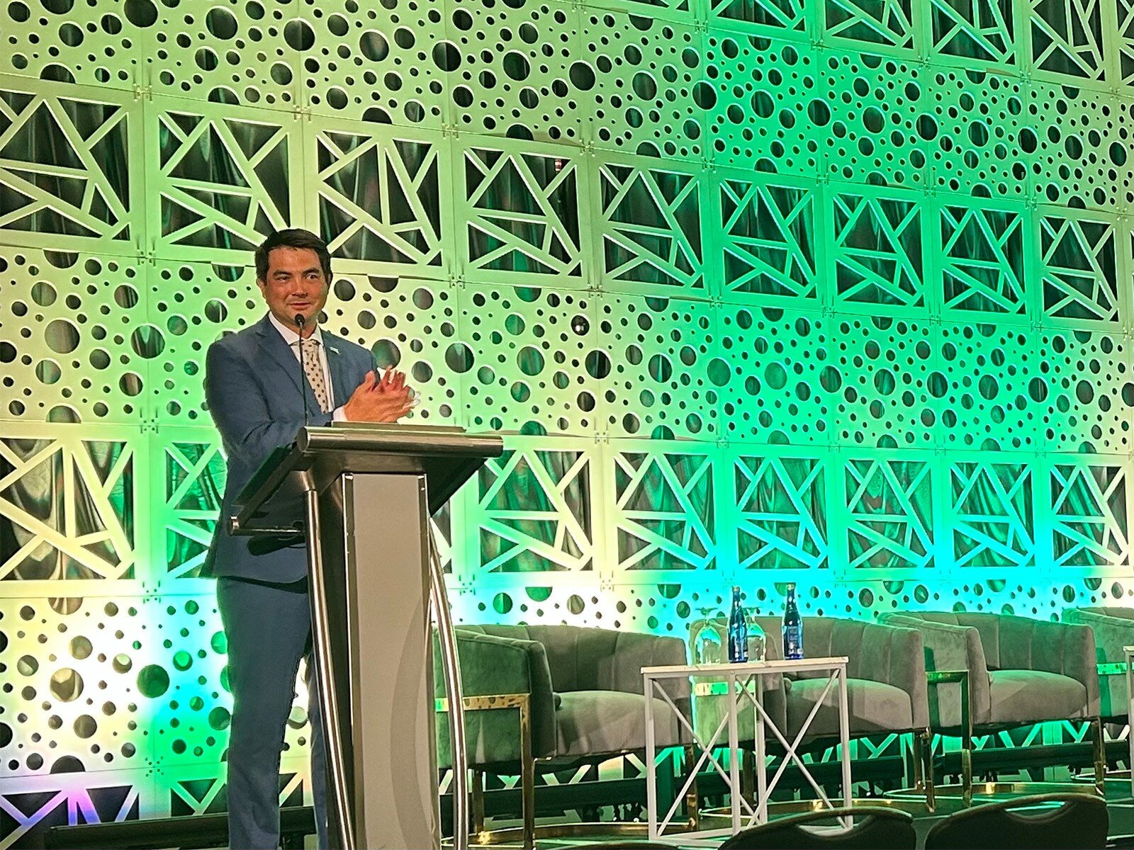 Opening keynote speaker George Bandy at the podium during the 2026 Flooring Sustainability Summit