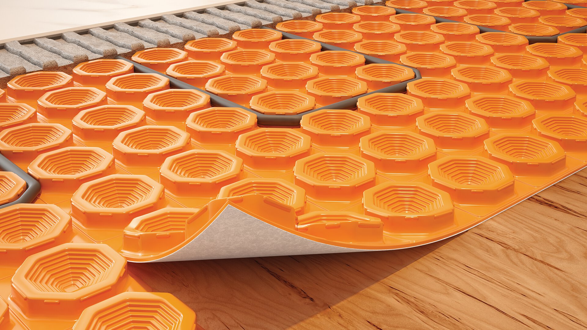 Peel-and-stick Schluter uncoupling membrane compatible with electric floor heating systems.