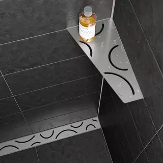 Sprchov&aacute; police Schl&uuml;ter-SHELF-E a sprchov&yacute; žl&aacute;bek Schl&uuml;ter-KERDI-LINE, oboje v designu FLORAL z kart&aacute;čovan&eacute; ušlechtil&eacute; oceli