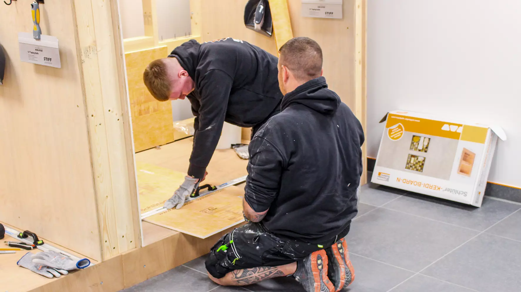 Two installers at the Schl&uuml;ter-Systems Ltd training centre, learning how to use our products
