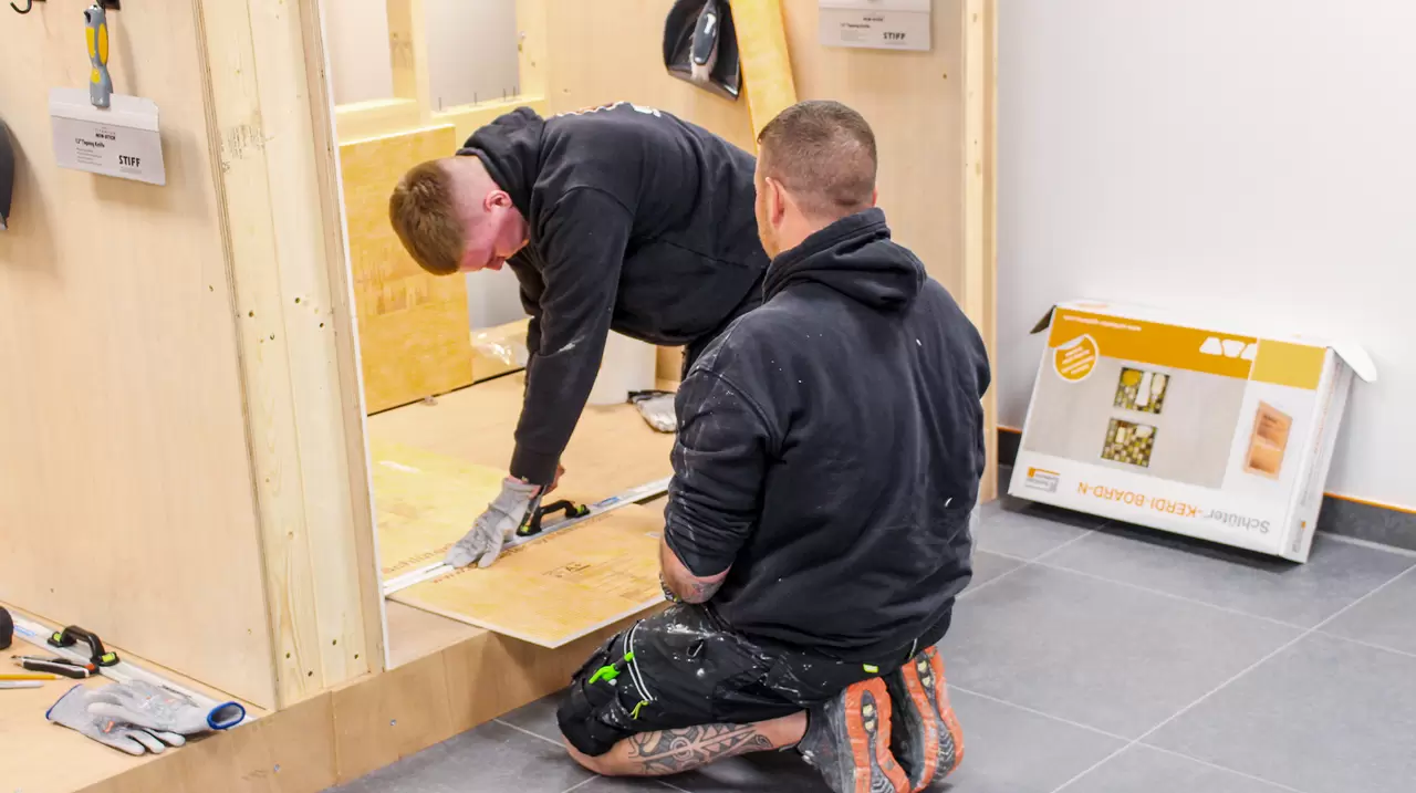 Two installers at the Schl&uuml;ter-Systems Ltd training centre, learning how to use our products