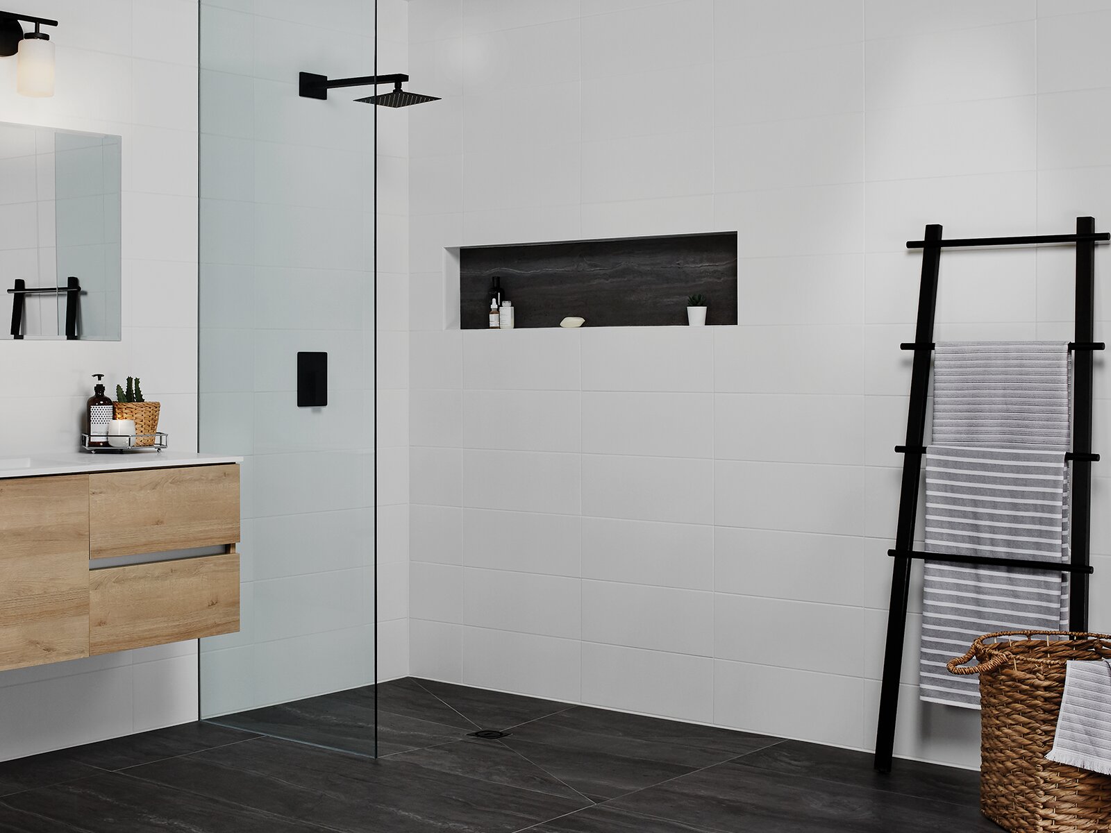 Flush, barrier free curbless shower completed with Schluter Systems KERDI-SHOWER-FRS and KERDI products
